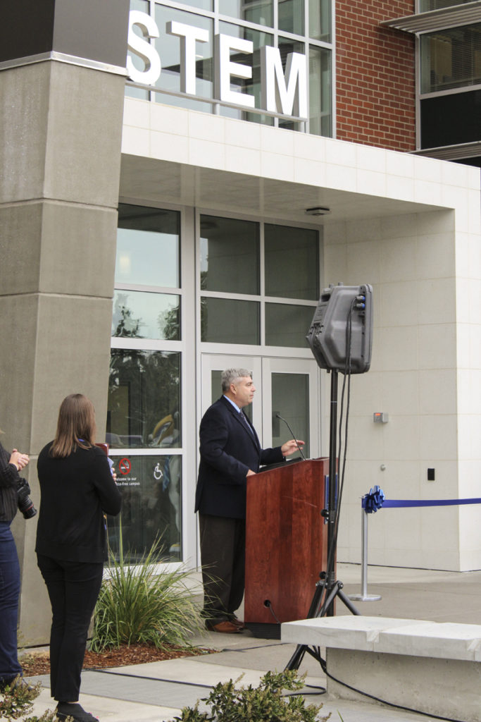 Clark College President Bob Knight speaks at the official Oct. 3 opening of his school’s STEM building, which will train students for careers in science, technology, engineering and mathematics fields. The building, which is the largest instructional facility on Clark College’s main campus, has been open to students since mid-September, but the official ribbon-cutting ceremony took place this week. Photo by Kelly Moyer.
