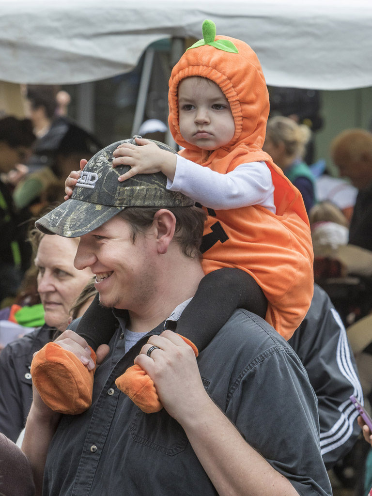 Jaxon Norton must have been thinking, ‘why walk when I can ride’ and Justin Norton was happy to oblige Wednesday at the Downtown Washougal Pumpkin Harvest Festival. Photo by Mike Schultz