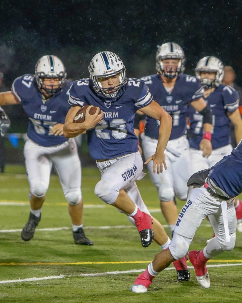 Skyview running back Hayden Froeber (23) runs for yards in a victory over Battle Ground Thursday at Kiggins Bowl. Photo by Mike Schultz.