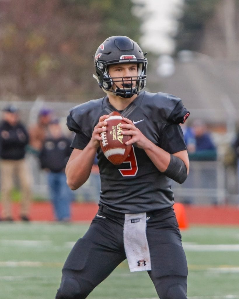 Camas quarterback Jake Colletto (9) drops back for a pass against Sumner. Photo by Mike Schultz