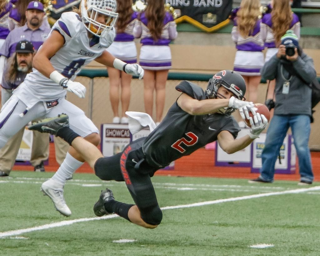 Camas wide receiver Ryan Rushall (2) reaches out for a catch against Sumner. Photo by Mike Schultz