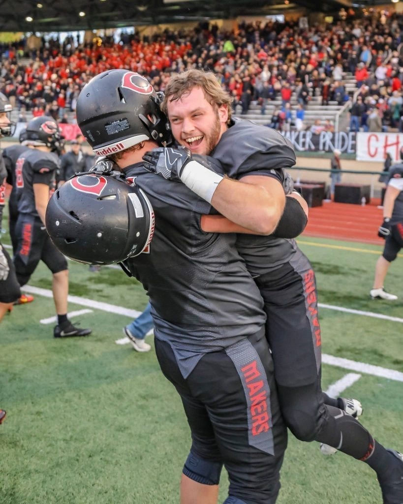 Camas offensive lineman Caleb Eldred celebrates with offensive lineman Vinny Gannaro after a victory over Sumner. Photo by Mike Schultz