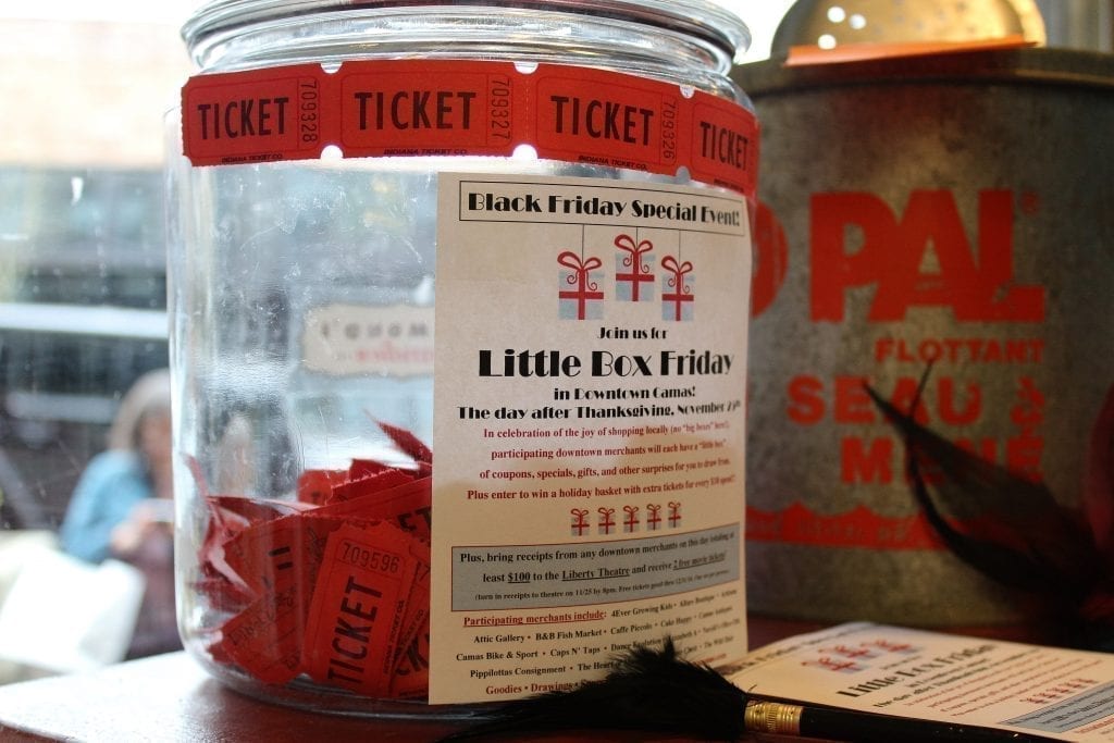 A raffle jar to collect raffle tickets for the Little Box Friday event in downtown Camas, is filling up at the Camas Antiques shop on Fri., Nov. 25. Photo by Kelly Moyer