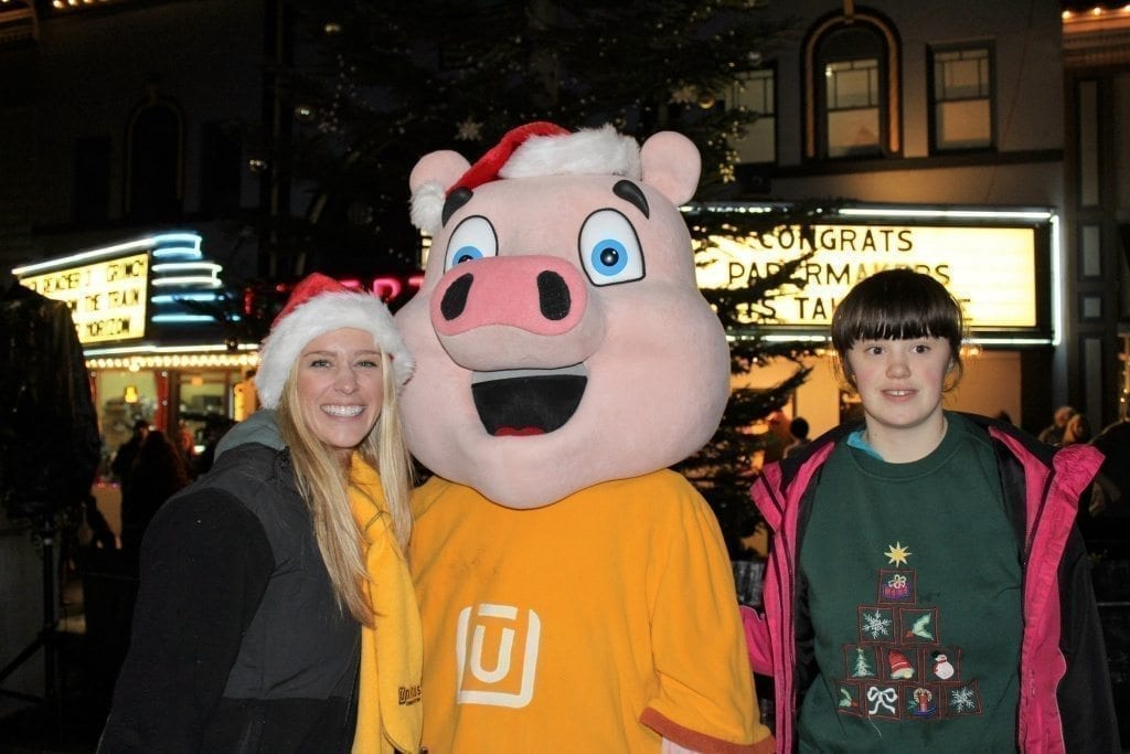 Tiffany Wooden, a teen from Troutdale (right) stops to meet Hamilton, the mascot of Unitus Credit Union, and Natalie Cook (left), a Unitus employee, at the annual Camas Hometown Holidays festival on Fri., Dec. 2, in downtown Camas. Unitus was one of the event sponsors for this year’s holiday celebration. Photo by Kelly Moyer