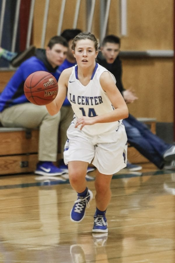 Junior guard Bethany Whitten (14) is one of La Center’s two co-captains this season. She displays her leadership on both offense and defense and has helped La Center amass a 13-0 record this season. Photo by Mike Schultz