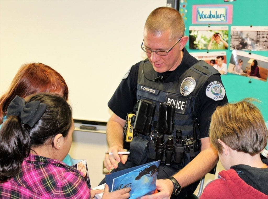 Vancouver Police Activities League, police officers share love of reading, stress gun safety with local third-graders