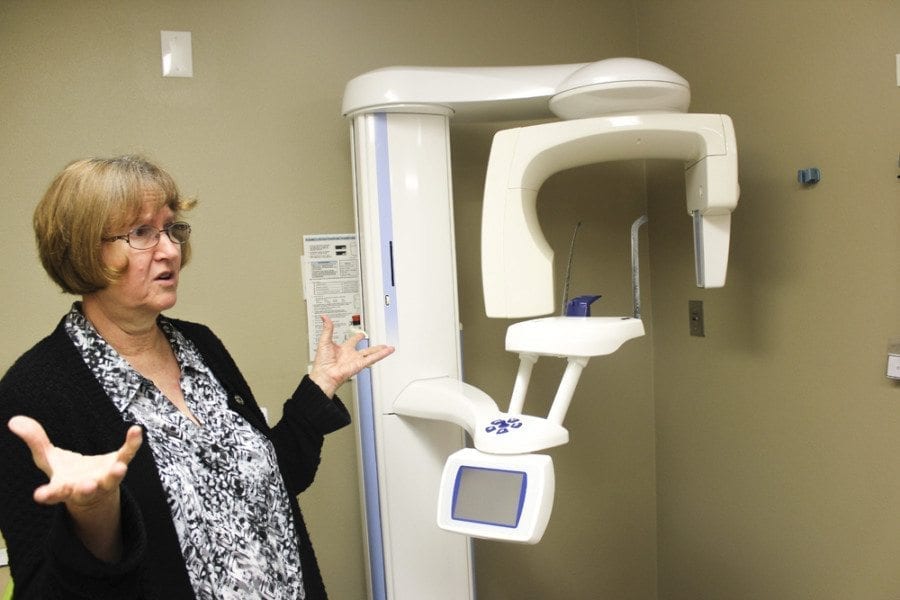 Ruthie Gohl of Battle Ground Health Care talks about the panoramic dental X-ray machine that they are now able to use as a part of the dental services offered at the Battle Ground Health Care clinic. Photo by Joanna Yorke
