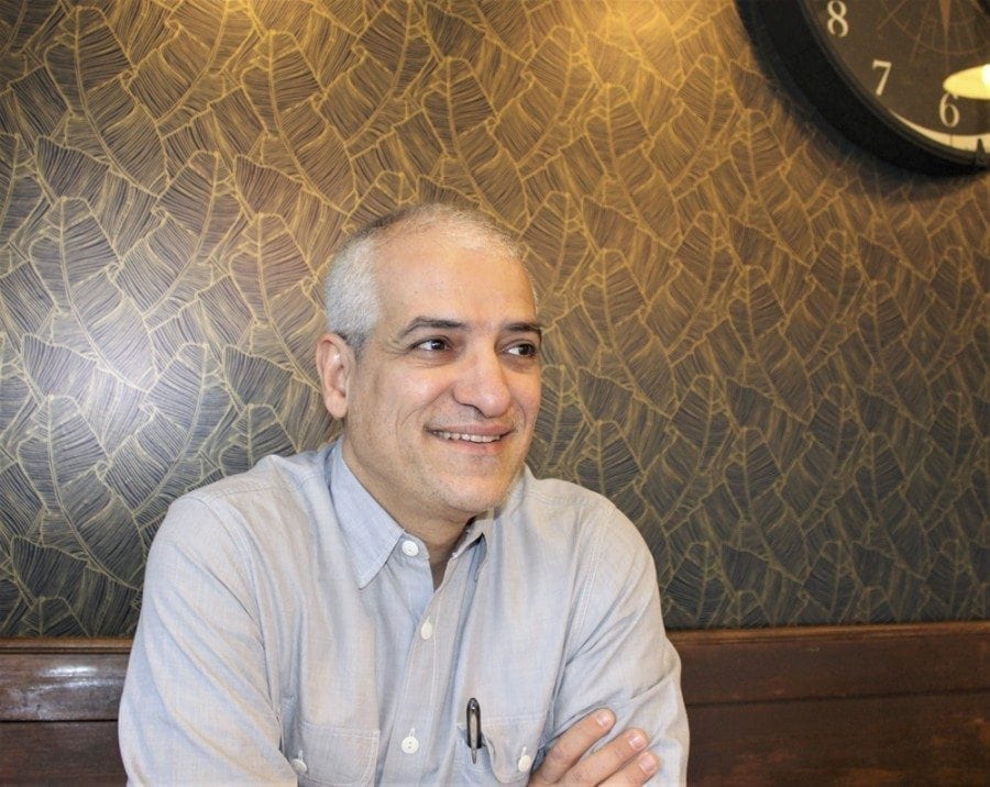 Dr. Mehrdad Shojaei, a hospitalist at the Legacy Salmon Creek Medical Center, reflects on his use of fine art photography to help heal patients and even complete strangers, at the Compass Coffee Roasting in downtown Vancouver on Fri., March 3. Photo by Kelly Moyer