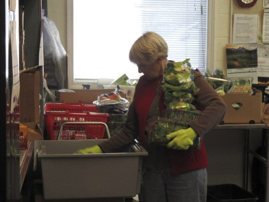 Pat Jeschke's work at the North County Community Food Bank includes rotating produce and other perishable items to ensure that clients receive fresh food. Photo courtesy of Carolyn Schultz-Rathbun