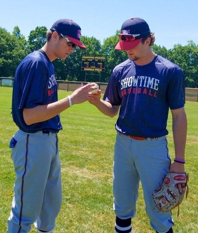 Damon Casetta-Stubbs (left) shows Showtime Baseball teammate Daniel Copelan his grip for a particular pitch. The two shined this week, along with the rest of the team, at an event in Texas. Showtime then made it back in time for the Curt Daniels Invitational. Photo by Paul Valencia