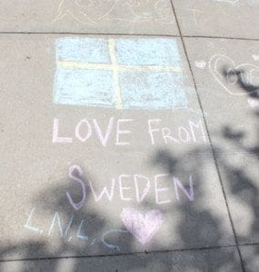 The Martensson family was visiting Vancouver from Sweden and stopped by Chalk the Walks, sending greetings from across the Atlantic. Photo by Alex Peru
