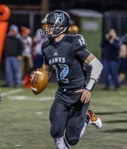Hockinson quarterback Canon Racanelli (12) threw six touchdown passes in the Hawks’ win over Aberdeen last week. The senior signal caller will lead his team into the first round of the state playoffs this week against Pullman. Photo by Mike Schultz