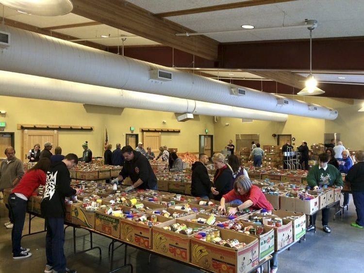 Volunteers will gather in the Battle Ground Community Center on Dec. 12 and 13 to pack food boxes for distribution in the annual Christmas Food Box Program. Photo courtesy of North County Community Food Bank