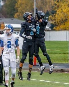 Hockinson receivers Jake Beslanowitch (2) and Matt Henry (25) celebrate after a touchdown in a playoff game with Pullman. The Hawks hope to have the opportunity to celebrate a number of touchdowns during Saturday’s Class 2A state championship game against Tumwater at the Tacoma Dome. Photo by Mike Schultz