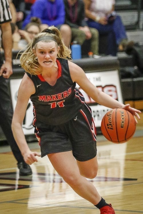 Haley Hanson (11) shows a determined look on her way down the court. Hanson had nine points in Camas’ win over Union. Photo by Mike Schultz