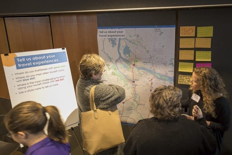 Clark County residents gathered at the Vancouver Public Library Tuesday to learn about Oregon’s proposal to add tolls to the interstates in Portland and provide feedback to ODOT representatives during an open house. Photo by Mike Schultz