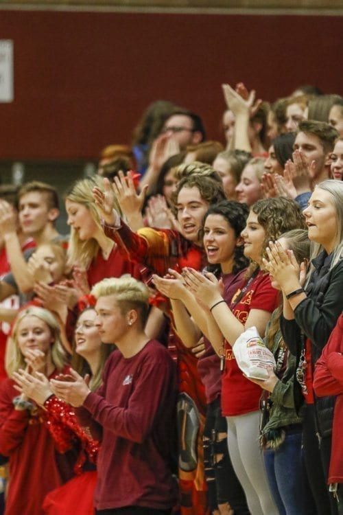 The Prairie student section got two playoff games for the price of one Wednesday night, cheering the girls and boys teams to victories in the bi-district tournament. Photo by Mike Schultz
