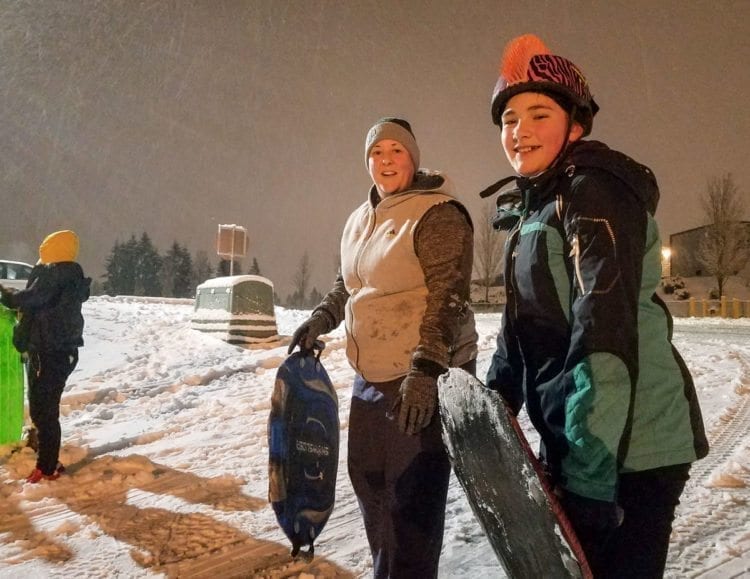Fiona Belden (right) and her mother Tricia Belden found the hill near McKenzie Stadium in east Vancouver to be a fun place to spend the wintry evening Wednesday. Photo by Paul Valencia