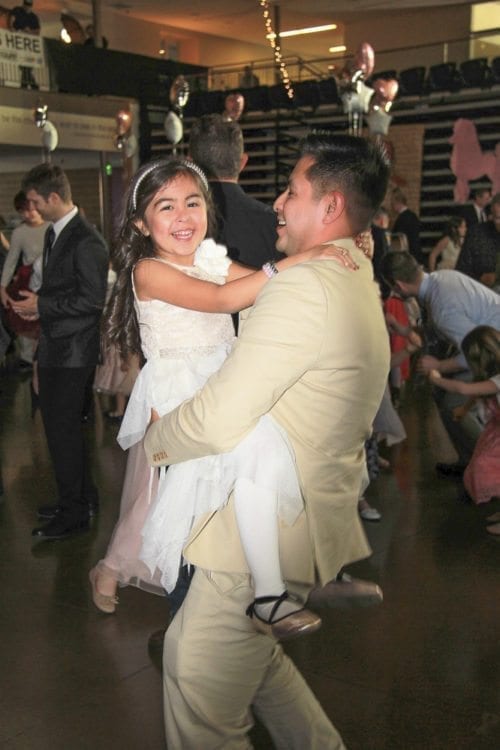 This father and daughter couldn’t hold back the smiles Saturday while enjoying the 14th annual Woodland Father/Daughter Ball at Woodland High School. Photo courtesy of Grace Community Church