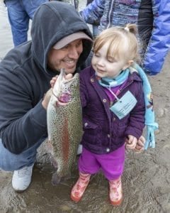Jason and Mai’ana Candaso, of Vancouver, pose with the young girl’s catch at the Klineline Kids Fishing Derby Saturday morning. Photo by Mike Schultz