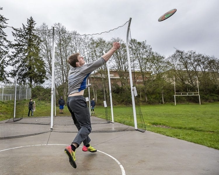The sky is the limit for Trey Knight’s athletic abilities. A sophomore from Ridgefield, he hopes to one day represent America in the Olympics in the hammer throw, but he also excels in the discus (shown here) and shot put. Photo by Mike Schultz