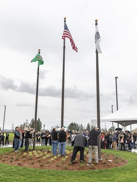The Cowlitz Tribal flag is raised for the first time in 160 years on tribal land. Photo by Mike Schultz