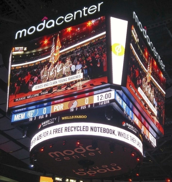 The Lewis & Clark Young Marines are pictured on the jumbotron at the Moda Center in Portland April 1. This photo was taken just hours before the group’s Suburban caught fire en route back to Clark County. Photo courtesy of Debbie Crawford