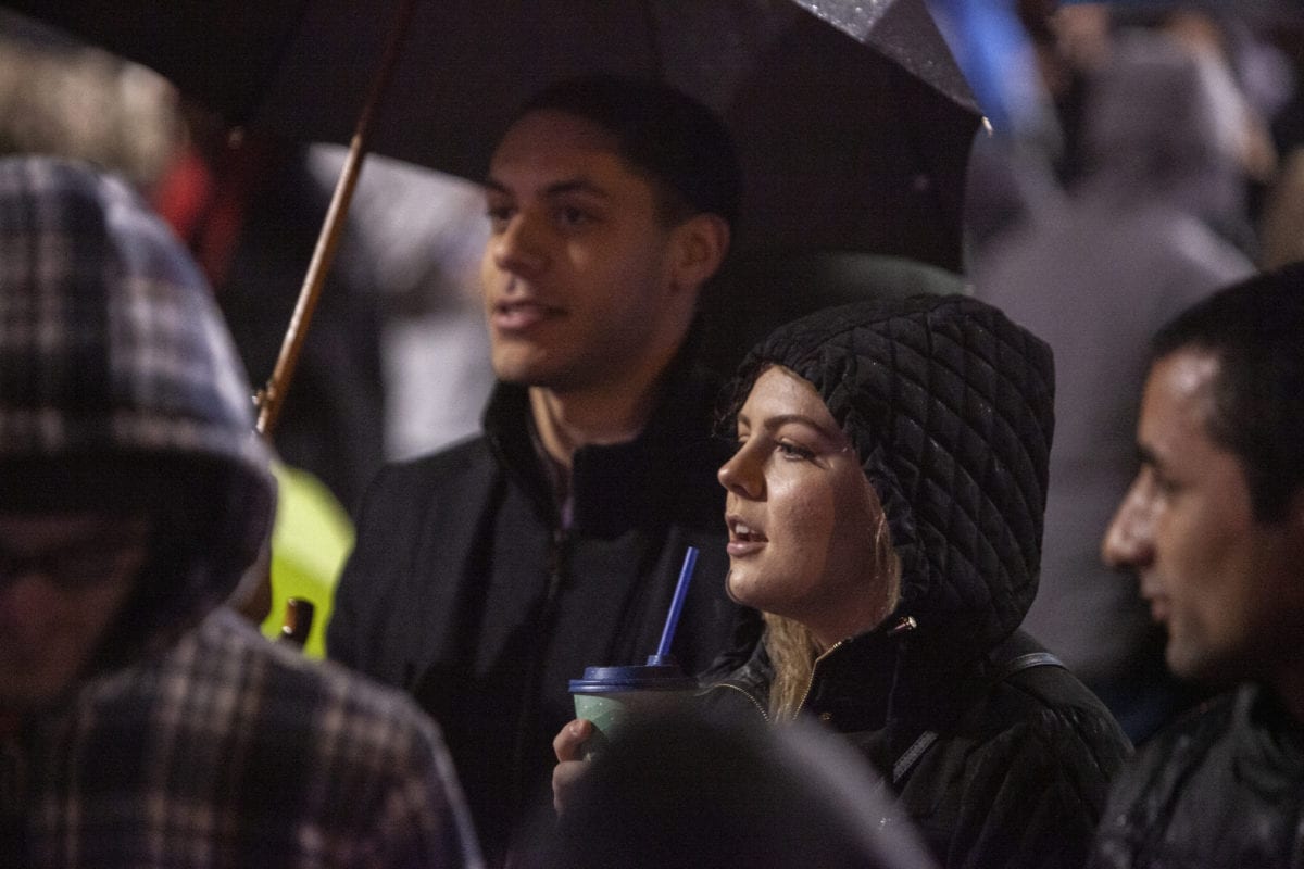 Deontae Peracca and his fiance Rylee Zimmerman sing along with the children’s choir as they sing Christmas carols at the Vancouver tree lighting ceremony. Photo by Jacob Granneman