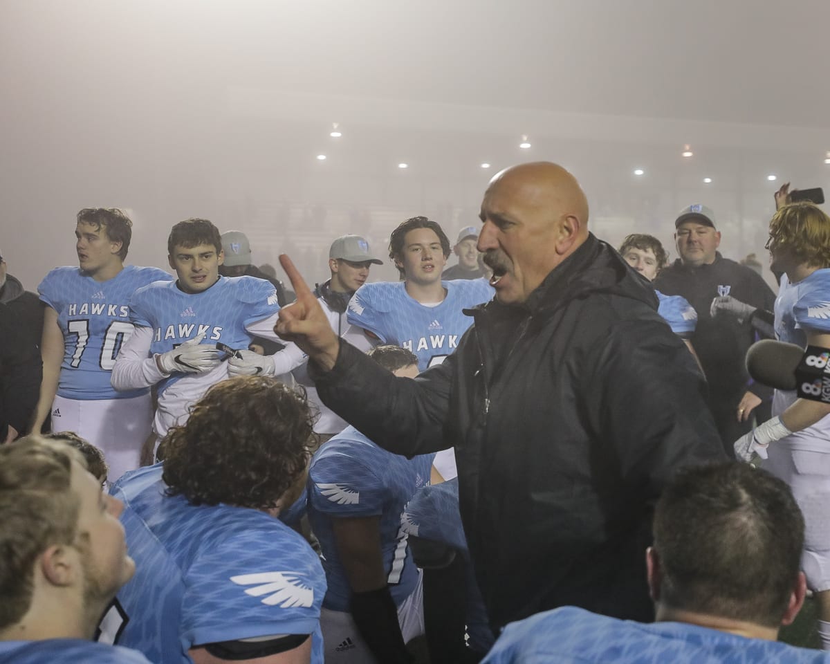 An emotional Hockinson coach Rick Steele addresses his team after Saturday’s 27-24 win over Liberty in the Class 2A state high school semifinals at McKenzie Stadium. Photo by Mike Schultz