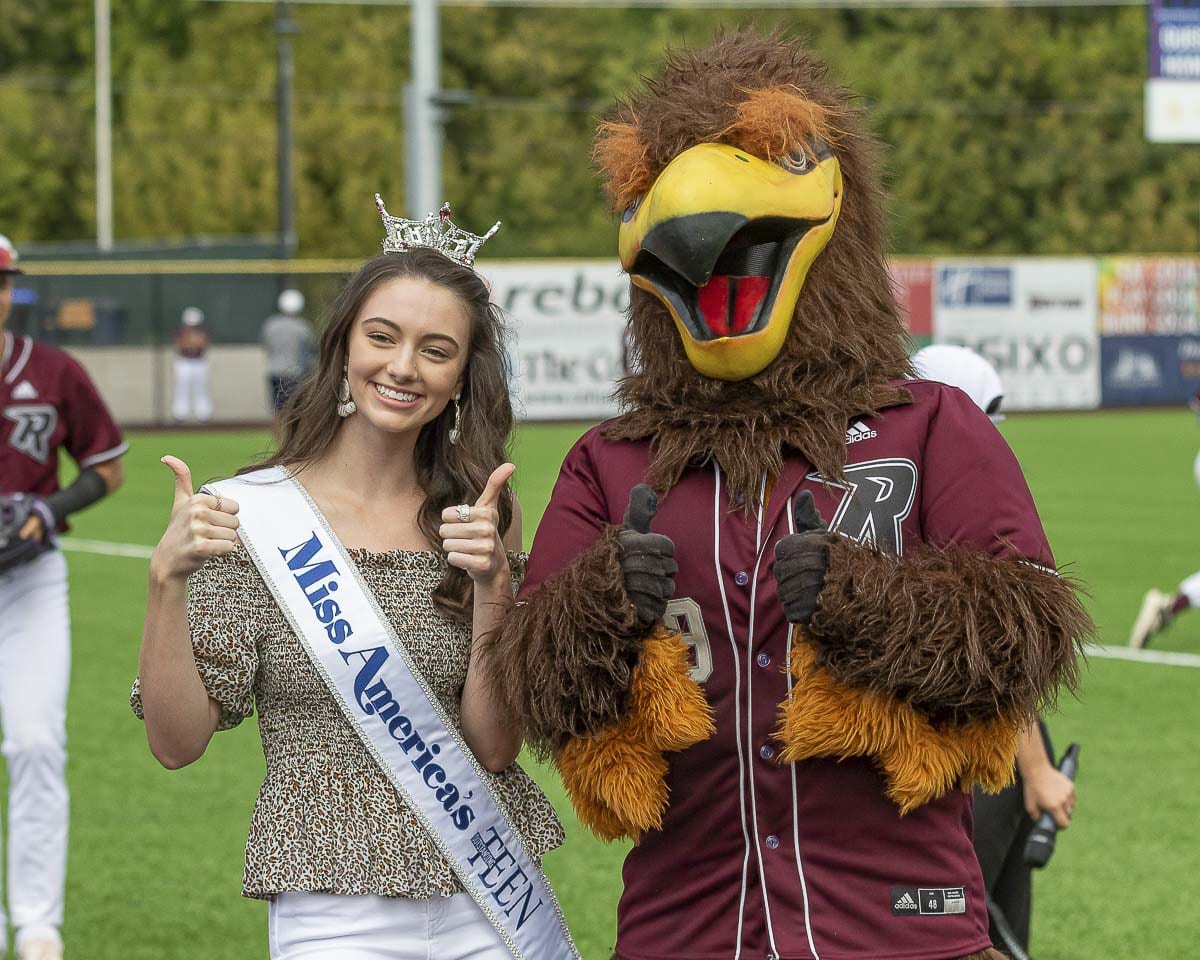 Vancouver’s Payton May (left), the 2019 Miss America’s Outstanding Teen, is shown here with Rally the Raptor at the season finale of the Ridgefield Raptors at the Ridgefield Outdoor Recreation Complex. Photo by Mike Schultz
