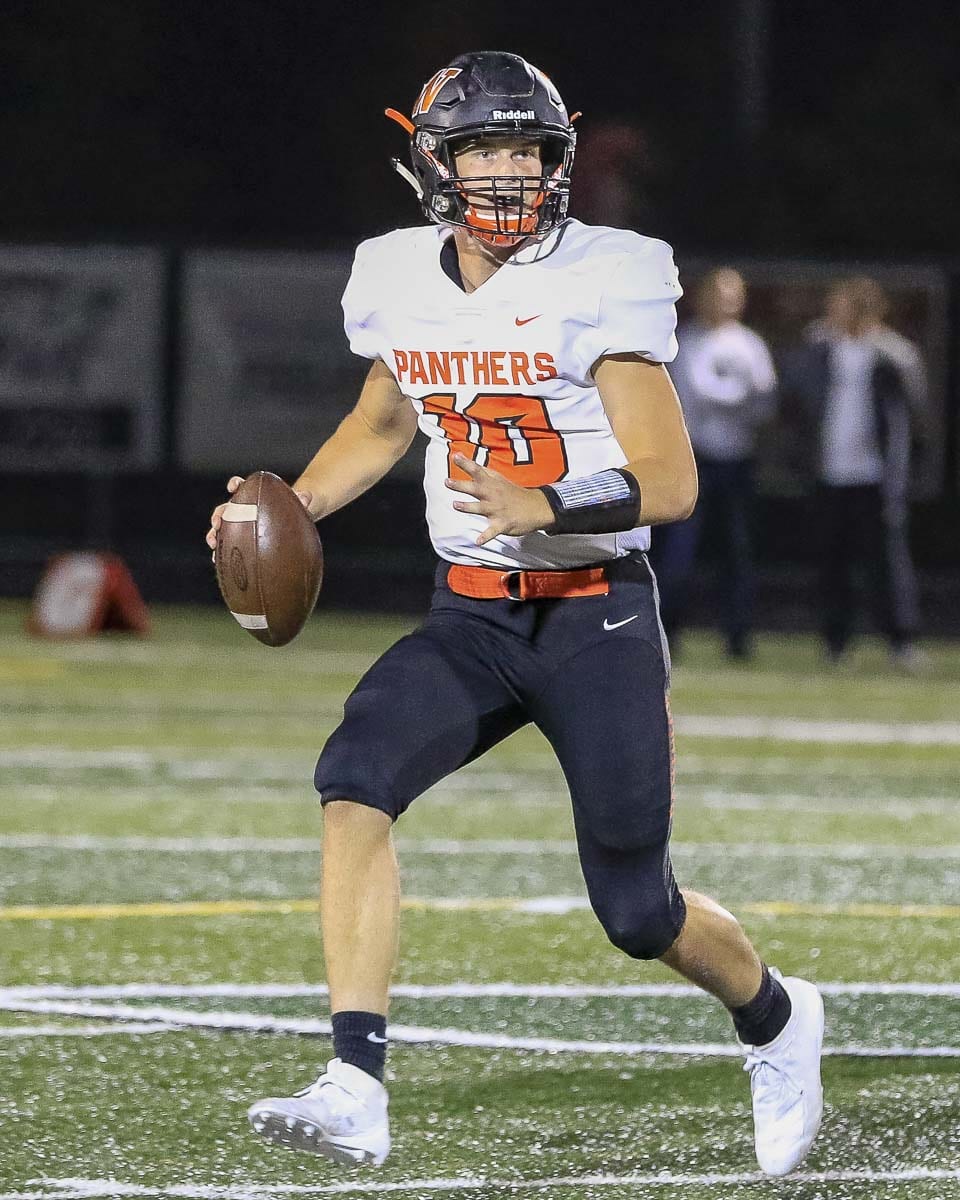 Washougal quarterback Dalton Payne looks downfield on his way to a 386-yard passing night. Photo by Mike Schultz