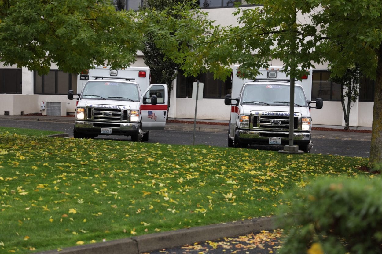 AMR Ambulances wait outside PeaceHealth Southwest Medical Center. Two people were transported there following a shooting at the Smith Tower in downtown Vancouver on Thursday afternoon. Photo by Jacob Granneman
