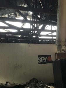 Shown here is the underside of the roof inside Racers Division after the fire. The heat caused a collapse of the roof and several support beams. Photo courtesy of John Cooper