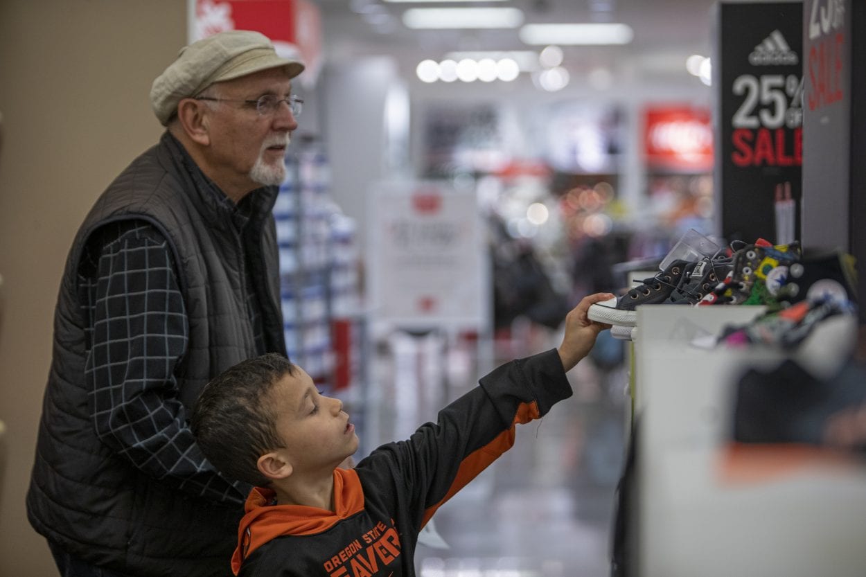  Roger Martin (left) helps Vinnie Castiglione find new shoes during the 2019 Santa Clothes event at JC Penny in the Vancouver Mall. Photo by Jacob Granneman 