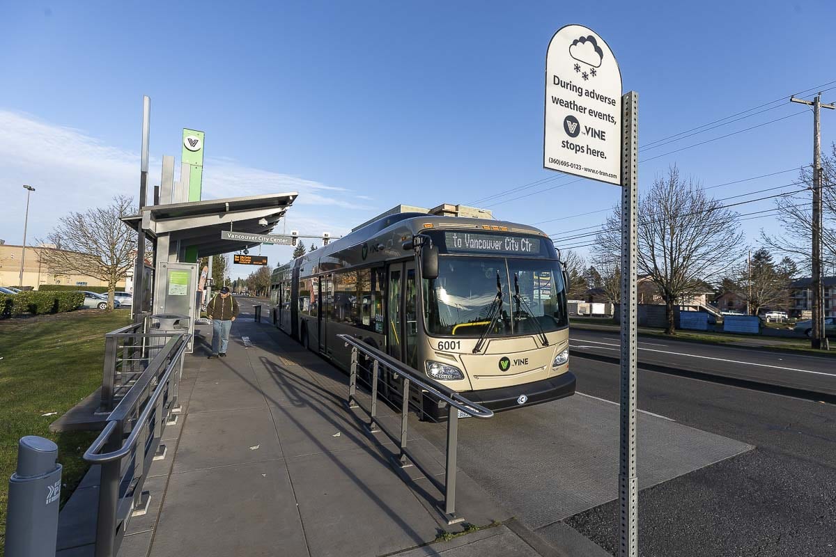 A lone commuter is shown here at a platform along The Vine, C-TRAN’s bus rapid transit system along NE Fourth Plain Blvd. in Vancouver. Photo by Mike Schultz