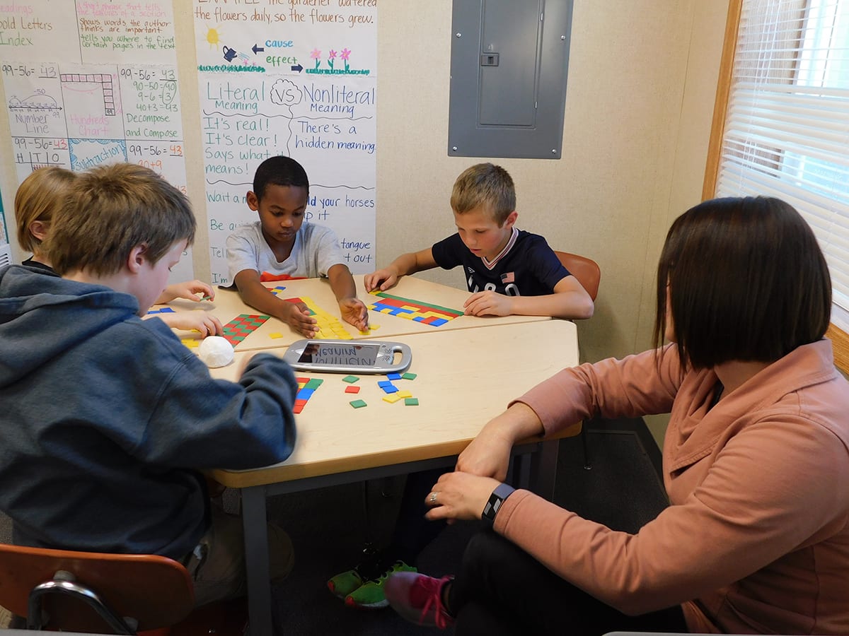 At her co-teaching station, South Ridge Elementary School teacher, Megan Suarez works with a group of students using colored squares to visualize multiplication. Photo courtesy of Ridgefield Public Schools