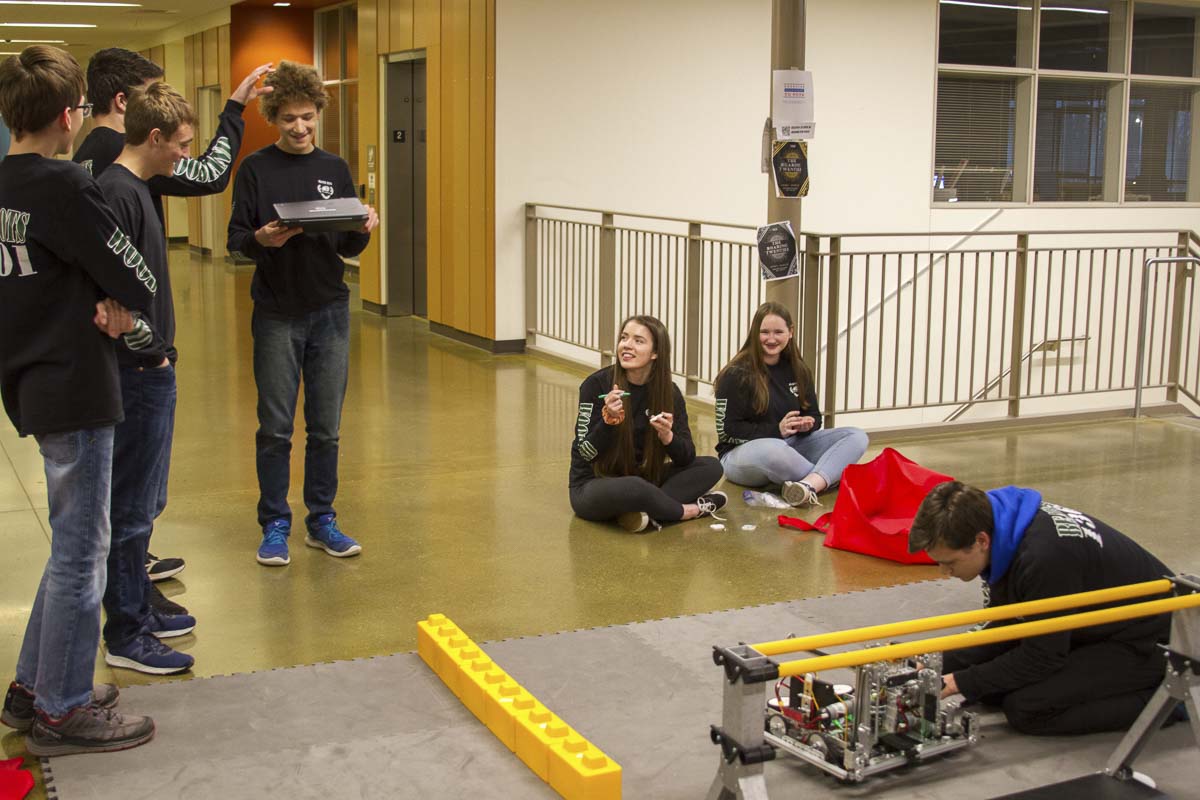 Programmers, builders, and project managers work closely together to create, program, and document a successful robot. Photo courtesy of Woodland Public Schools