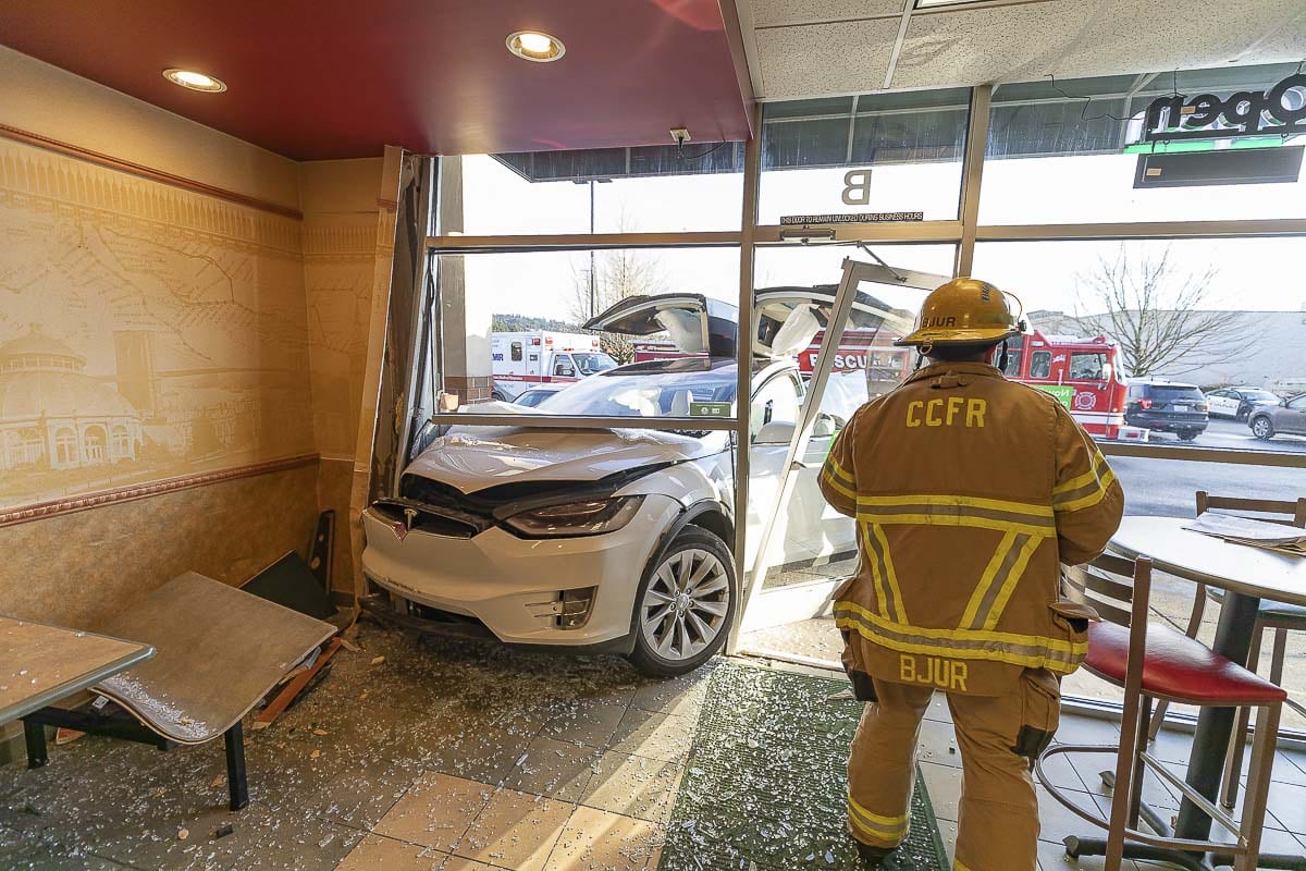 Customers say the angle this Tesla struck a Woodland Subway restaurant on Sunday likely prevented injuries to people inside the building. Photo by Mike Schultz