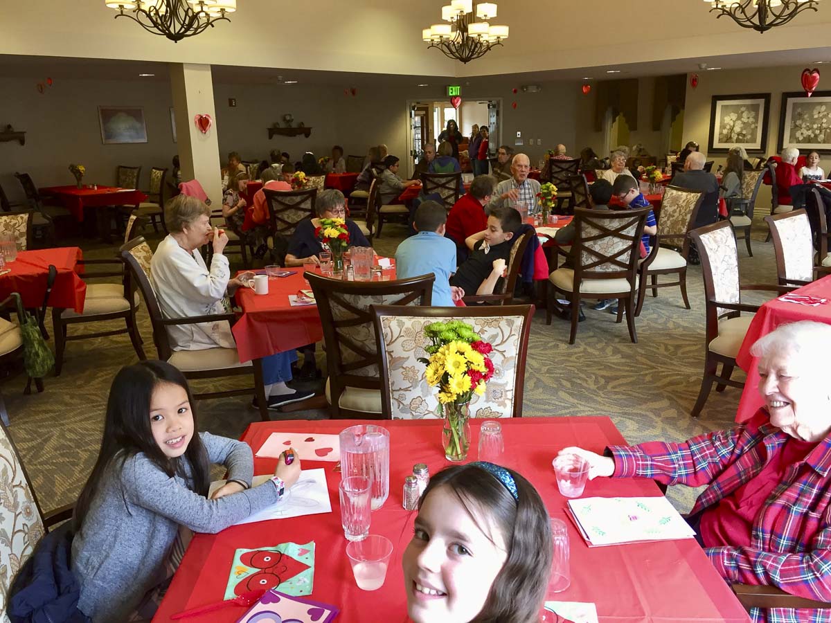 South Ridge Elementary fourth graders enjoy Valentine's Day lunch with their senior friends at Highgate Senior Living Center. Photo courtesy of Ridgefield Public Schools