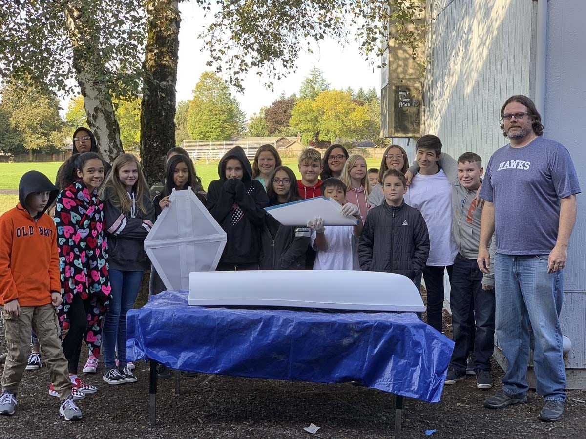 Joe Boken’s seventh grade science class at Wy’east Middle School pose with their mini-boat to be sent to their sister school in Japan. Photo courtesy Columbia River Maritime Museum