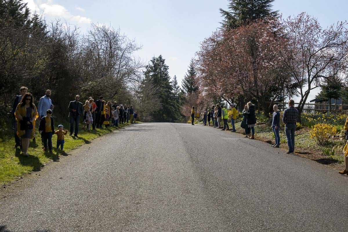 Hundreds lined up from the driveway of Hockinson Apostolic Lutheran Church down NE 164th Street to 182nd Avenue on Wednesday to honor Rosa and Juniper Wilson, killed earlier this month in a head-on car crash. Photo by Chris Brown