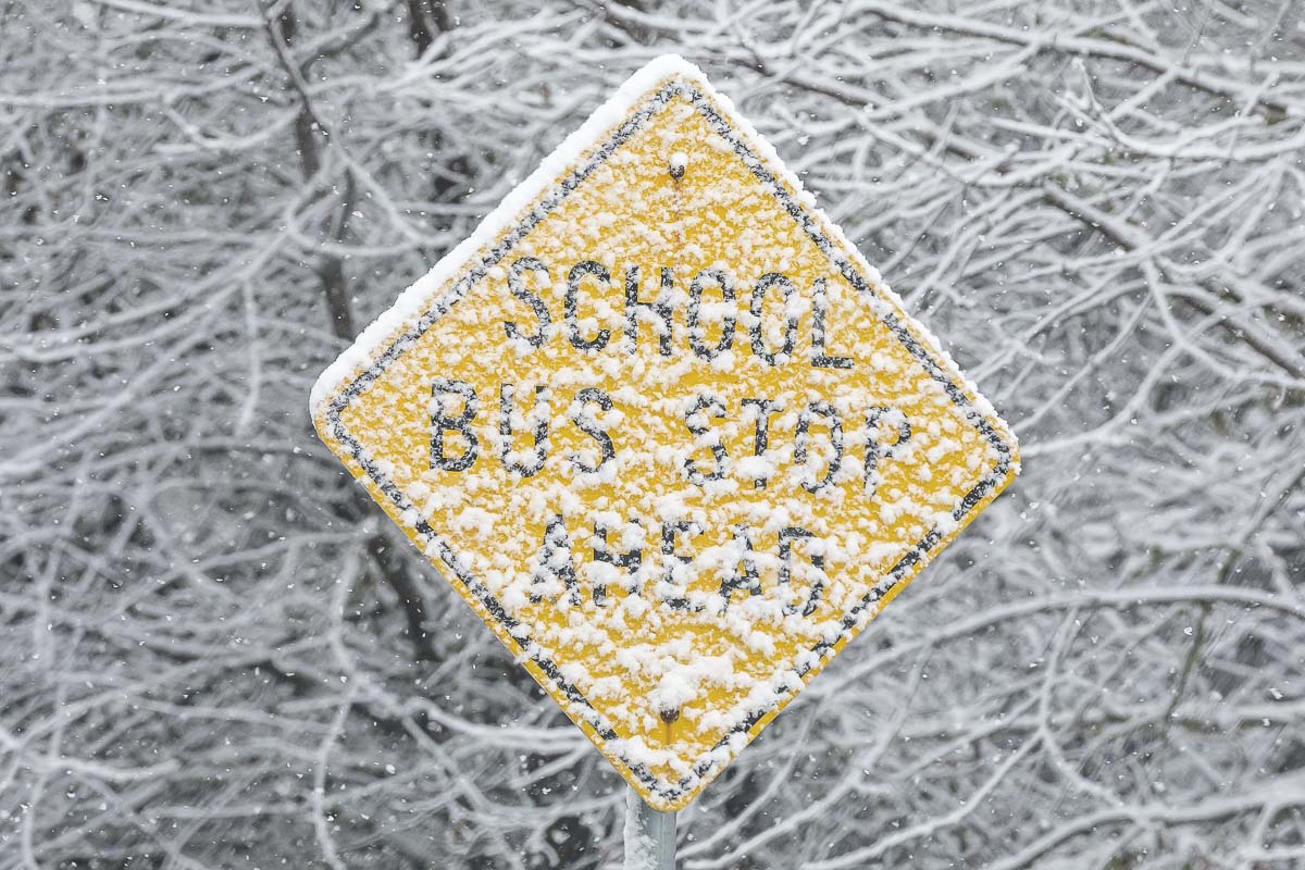 Snow blankets a school bus stop sign along Kelly Road in Yacolt Saturday morning. Photo by Mike Schultz