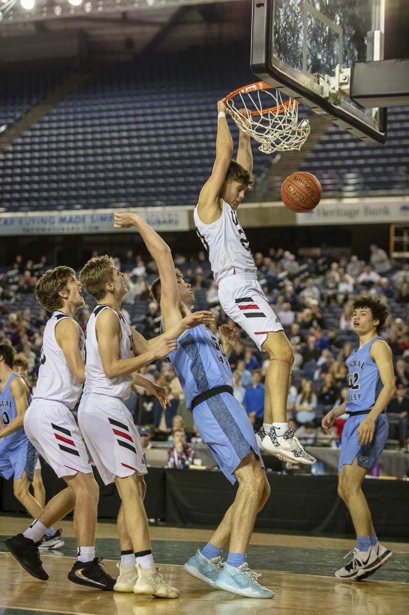 Josh Reznick slams one home after an offensive rebound during Union’s rally in the fourth quarter Friday. The rally would fall short, though. Central Valley beat Union in the 4A boys state semifinals. Photo courtesy Heather Tianen