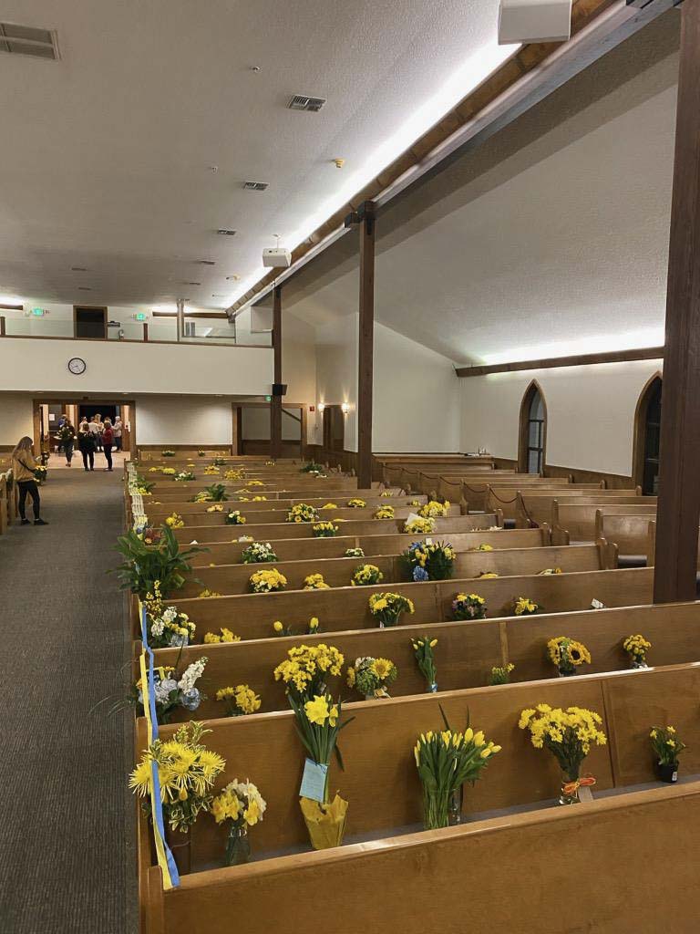 Yellow flowers filled the seats at Hockinson Apostolic Lutheran Church during the funeral for Rosa and Juniper Wilson, due to a restriction on gatherings of more than 50 people in Washington state. Photo courtesy Hockinson Apostolic Lutheran Church