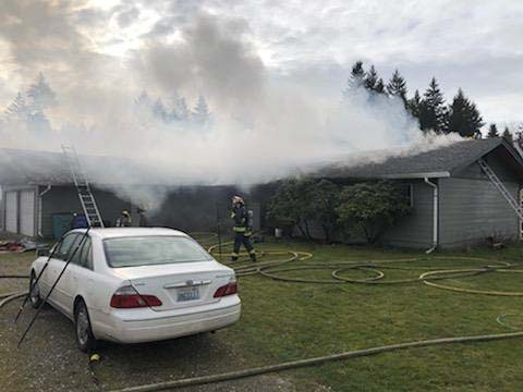 Firefighters stretched hoselines to attack the fire from the outside before heading inside the house to finish extinguishing the fire, which took 24 minutes. Photo courtesy of Vancouver Fire Department