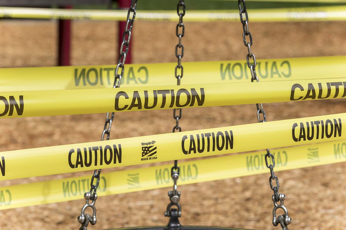 Yellow caution tape surrounds a play structure at Davis Park in Ridgefield. Photo by Mike Schultz