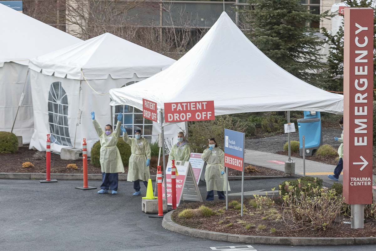 As seen here, PeaceHealth has nurses stationed outside under caapoys right now to reduce the amount of patients waiting inside the building.Photo by Mike Schultz