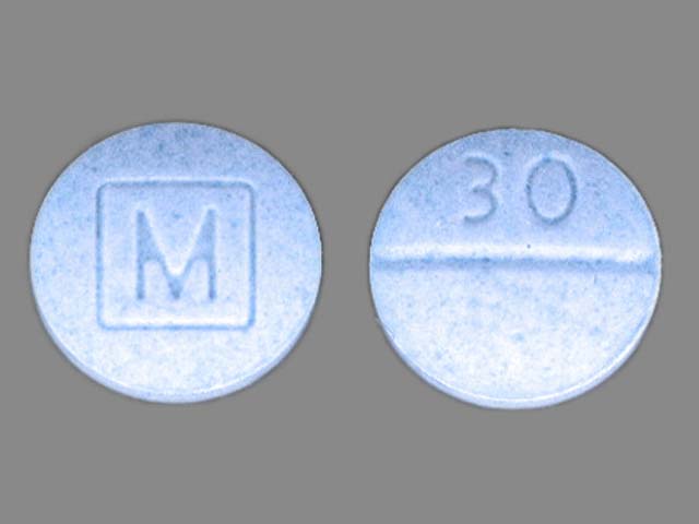 This is a photograph of real Oxycodone pills. The counterfeit pills have similar markings. Photo courtesy of Vancouver Police Department