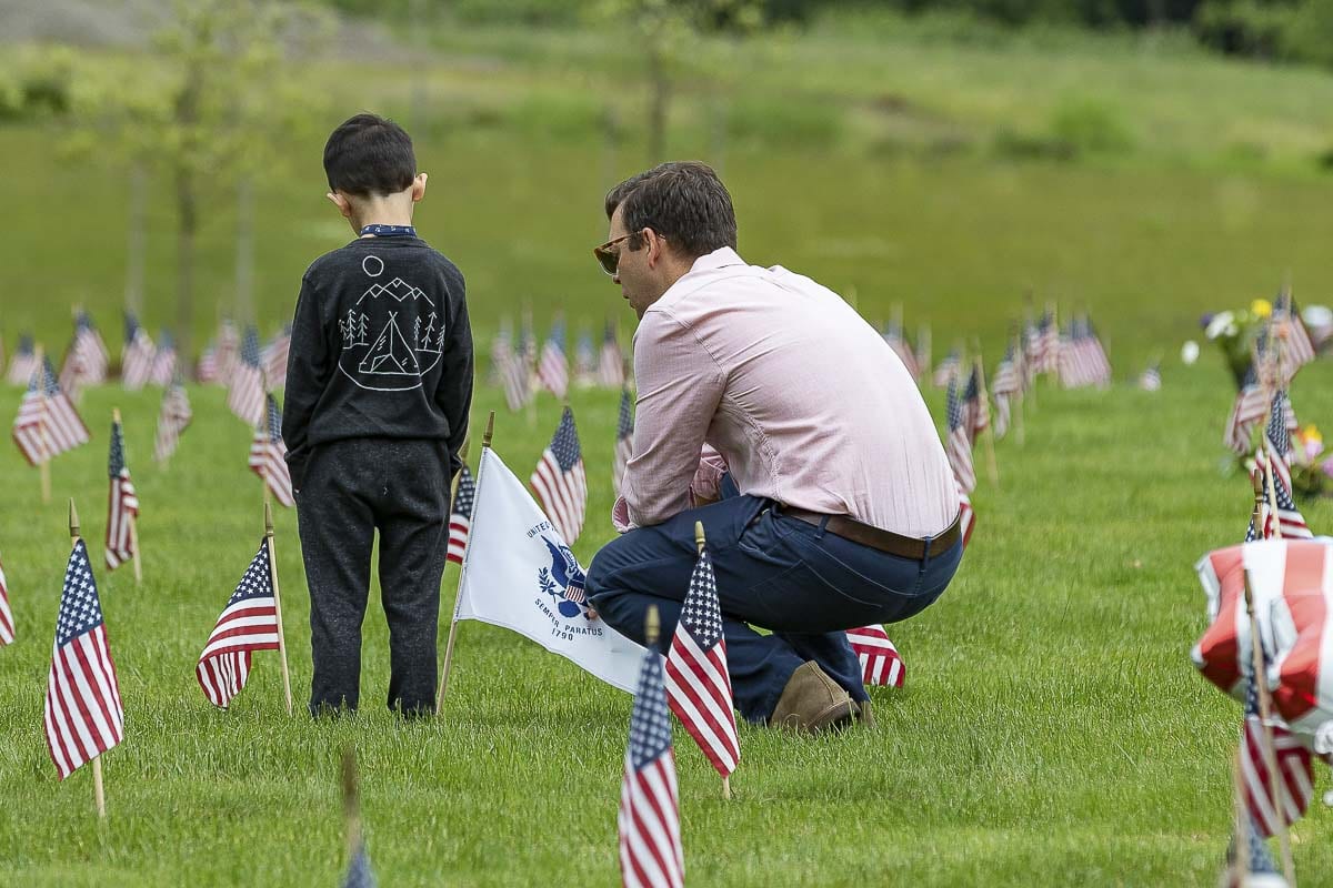 Families and friends may continue the tradition of placing flowers and small American flags at their veteran’s gravesite. Photo by Mike Schultz