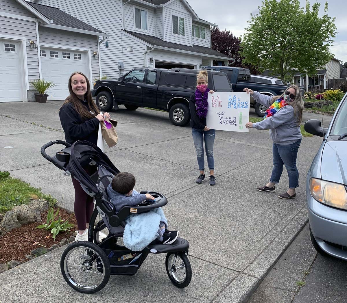 The PASS team is excited to see their students during deliveries ... if only at an appropriate distance due to social distancing guidelines. Photo courtesy of Woodland Public Schools